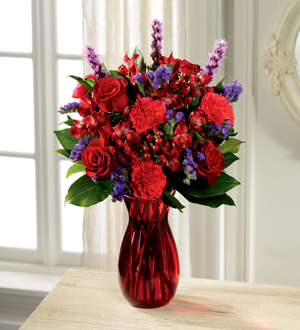 Bouquet of Red and purple flowers in a red vase